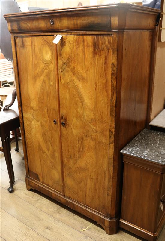 A Continental walnut two-door wardrobe W.105cm